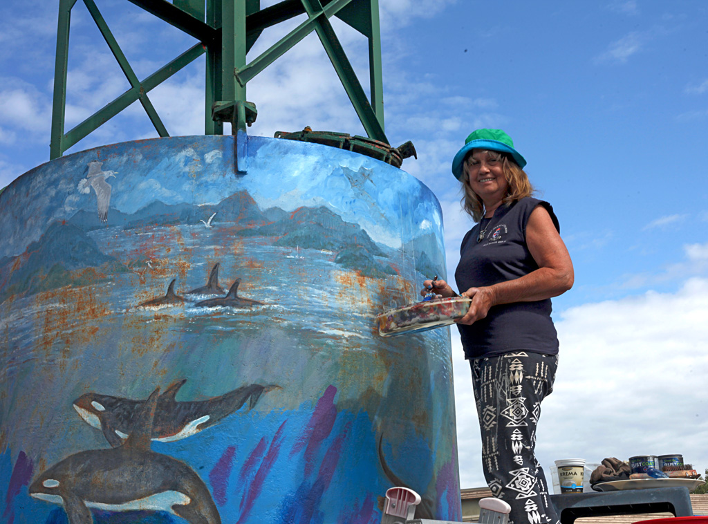 Landmark Mural repainting - A decommissioned marine buoy, Harbour Authority, Ganges, Salt Spring Island 2016